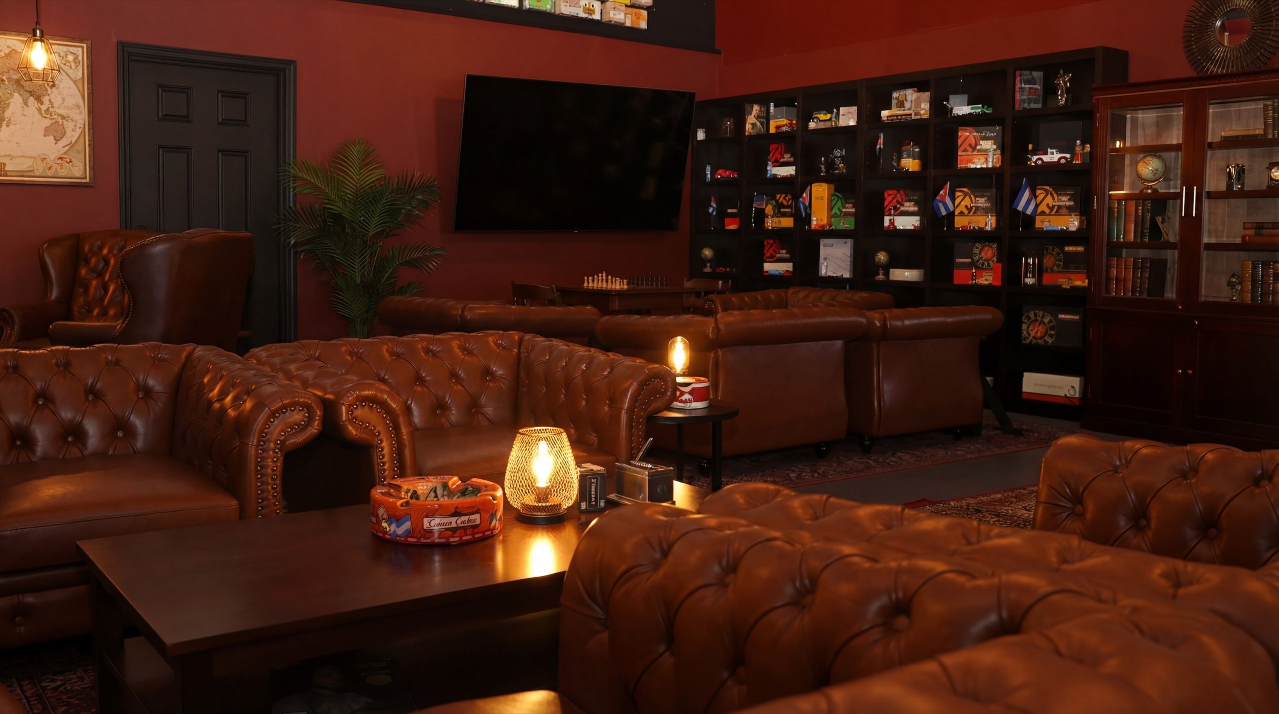Intimate seating area at Cuban Social Club with wingback leather chairs, Edison lamps, and warm ambient lighting