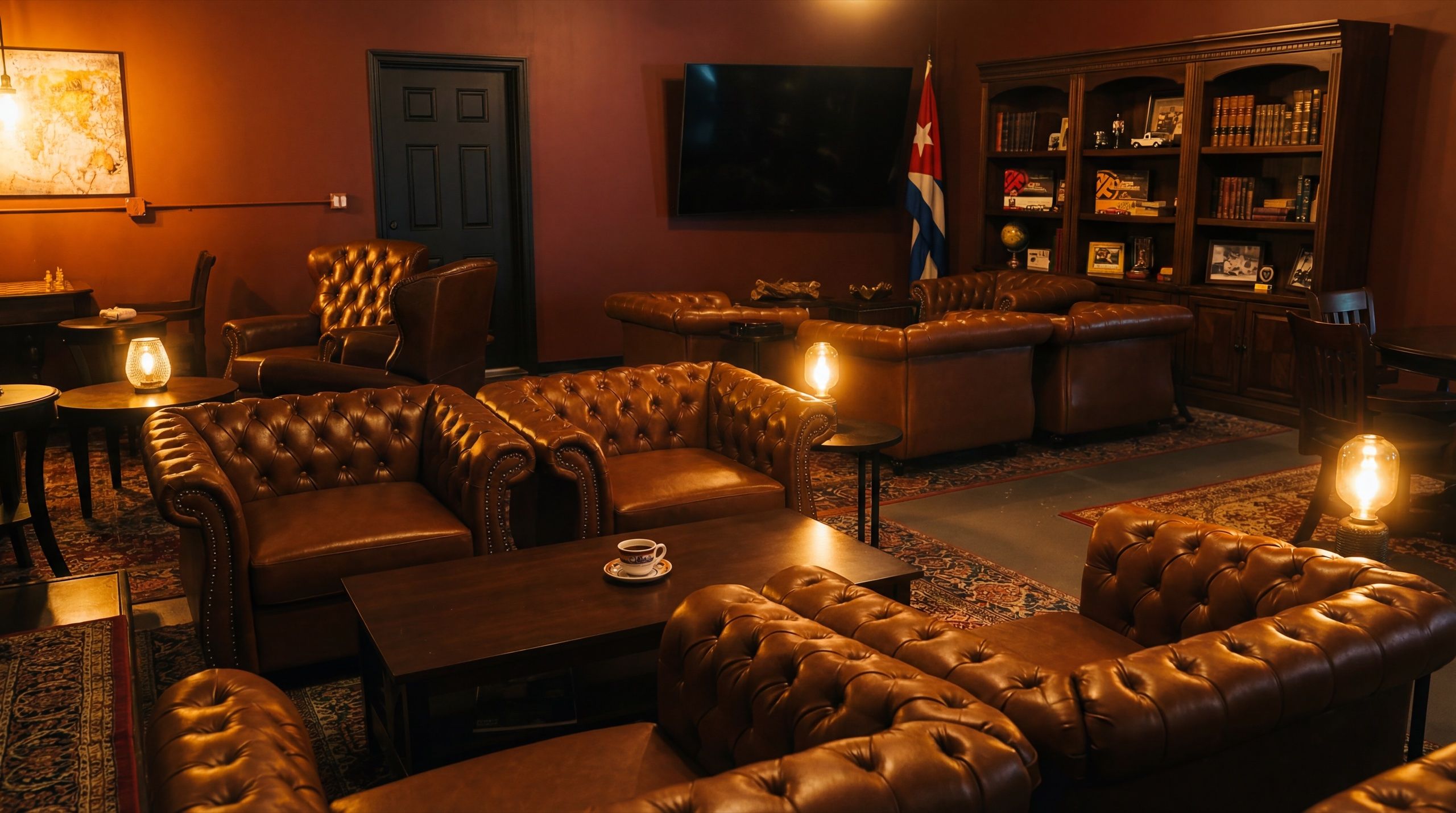 Interior of Cuban Social Club showing a warm, inviting lounge with Chesterfield leather sofas, Edison lamp lighting, and vintage Cuban decor
